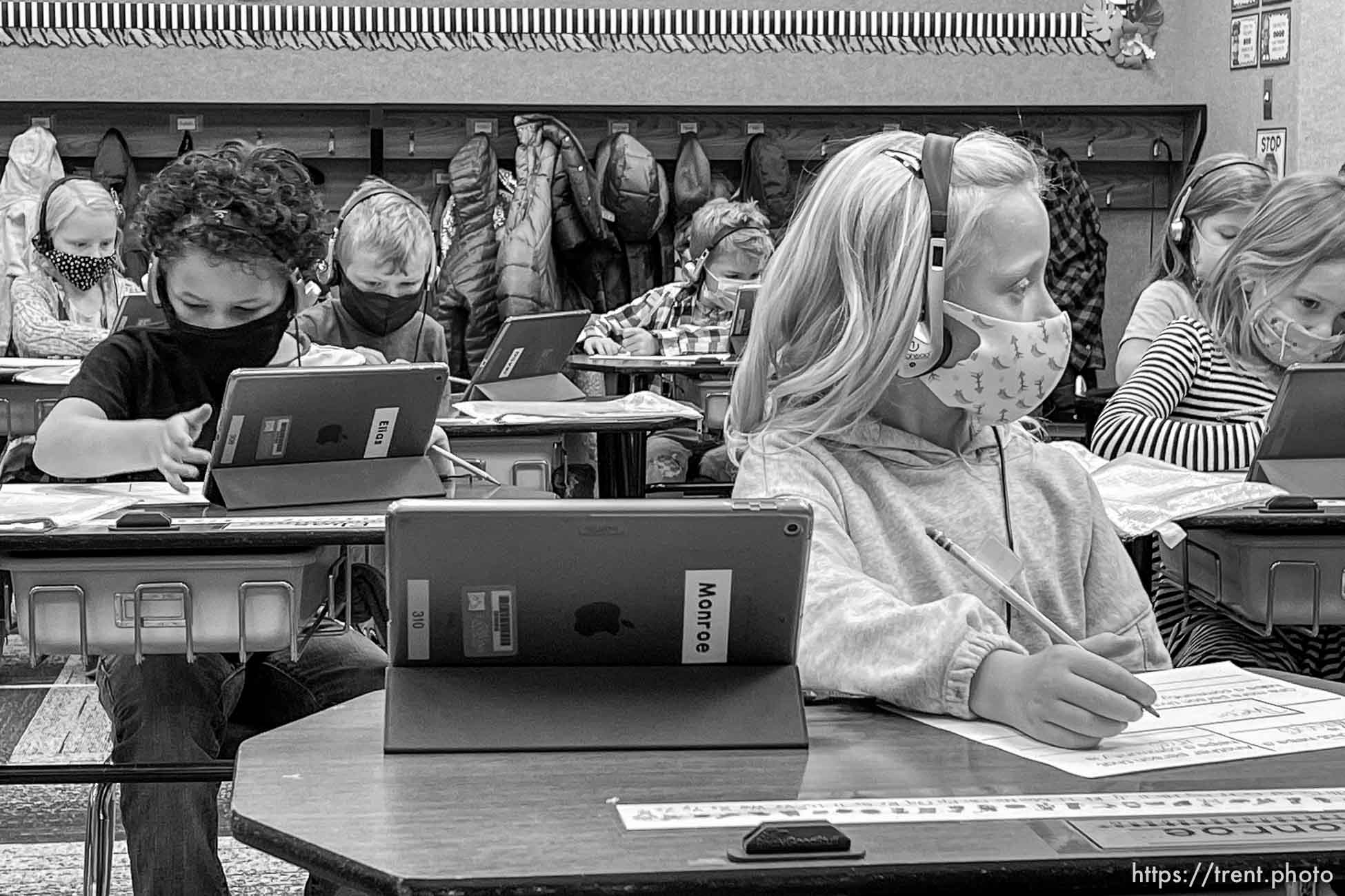 (Trent Nelson  |  The Salt Lake Tribune) Students in Marci Weatherspoon's first grade class work on a reading assignment at Crescent Elementary in Sandy on Thursday, Dec. 10, 2020. Statewide, just 46% of incoming first graders came to school this fall at or above benchmark proficiency in early literacy. Crescent Elementary has had success in getting their kids back on level by doing things like recording lessons for students to watch while in class and the teacher then works one on one with students who need more help.