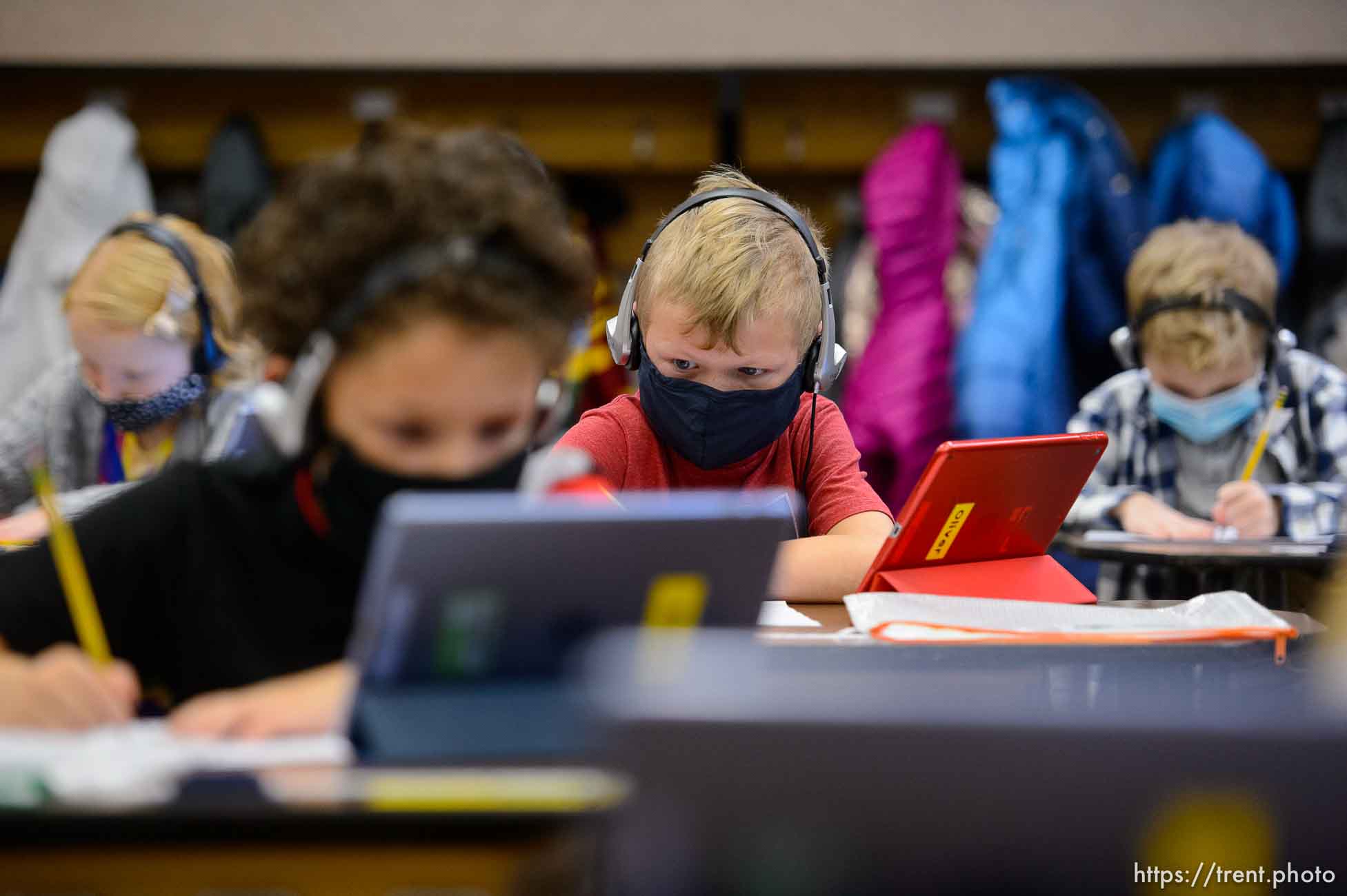 (Trent Nelson  |  The Salt Lake Tribune) Students in Marci Weatherspoon's first grade class work on a reading assignment at Crescent Elementary in Sandy on Thursday, Dec. 10, 2020. Statewide, just 46% of incoming first graders came to school this fall at or above benchmark proficiency in early literacy. Crescent Elementary has had success in getting their kids back on level by doing things like recording lessons for students to watch while in class and the teacher then works one on one with students who need more help.