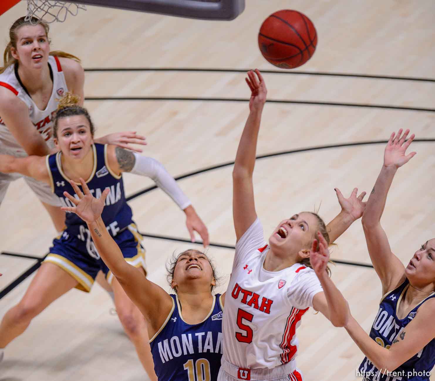 (Trent Nelson  |  The Salt Lake Tribune) Utah Utes forward Zuzanna Puc (5) collides with Montana State Bobcats forward Kola Bad Bear (10) as Utah hosts Montana State, NCAA basketball in Salt Lake City on Friday, Dec. 11, 2020.