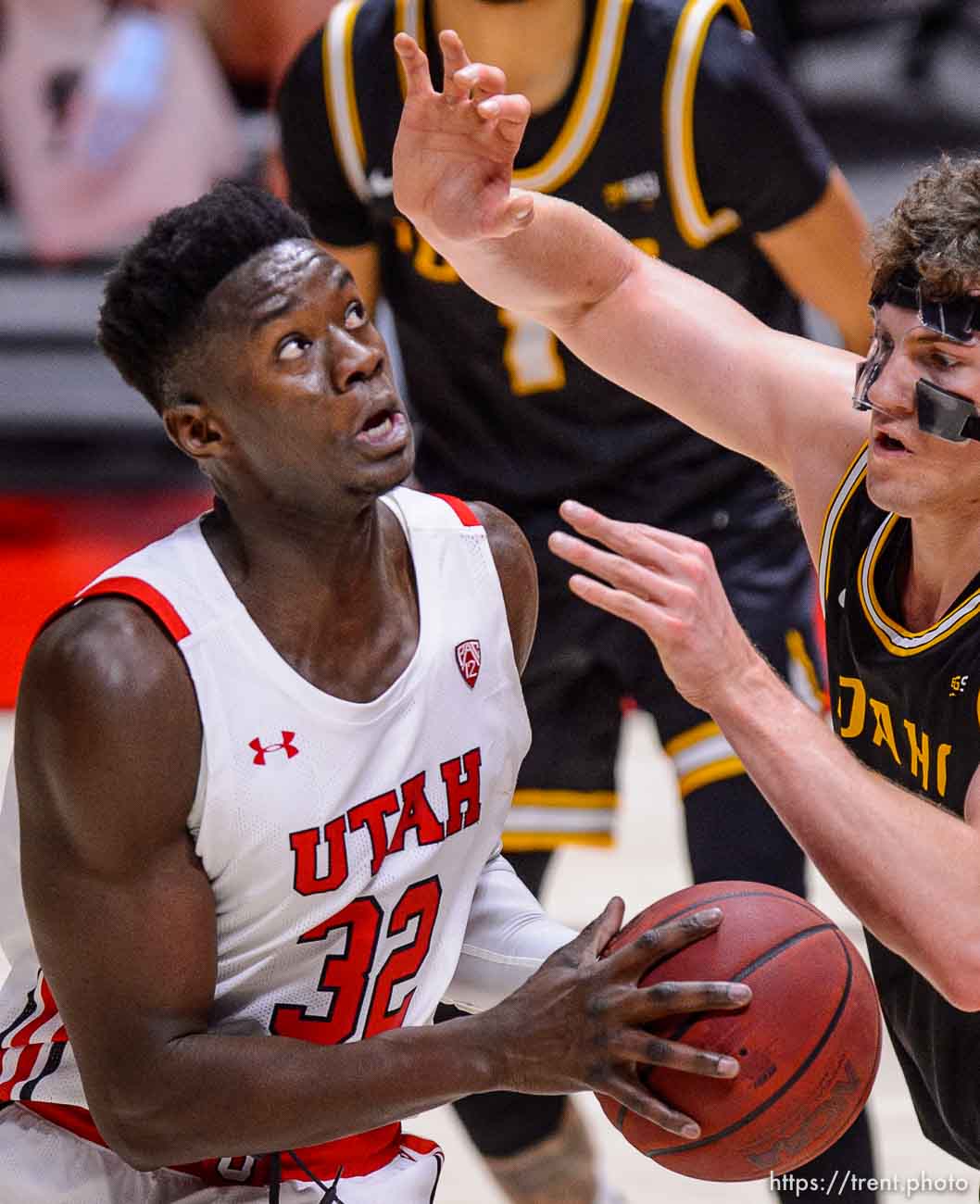 (Trent Nelson  |  The Salt Lake Tribune) Utah Utes center Lahat Thioune (32) defended by Idaho Vandals forward Scott Blakney (34) as Utah hosts Idaho, NCAA basketball in Salt Lake City on Friday, Dec. 18, 2020.