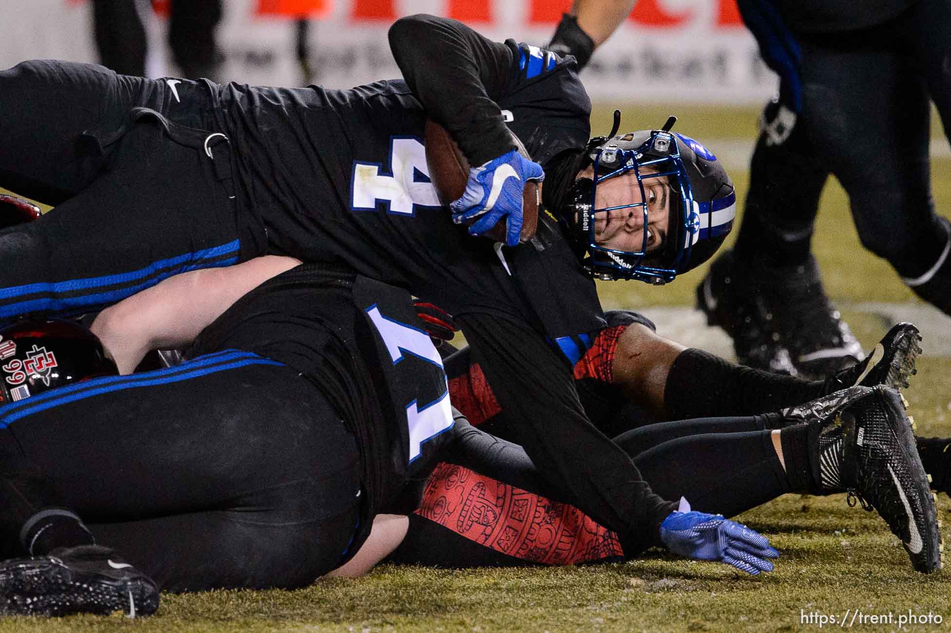 (Trent Nelson  |  The Salt Lake Tribune) Brigham Young Cougars running back Lopini Katoa (4) stretches out for more yardage as BYU hosts San Diego State, NCAA football in Provo on Saturday, December 12, 2020.