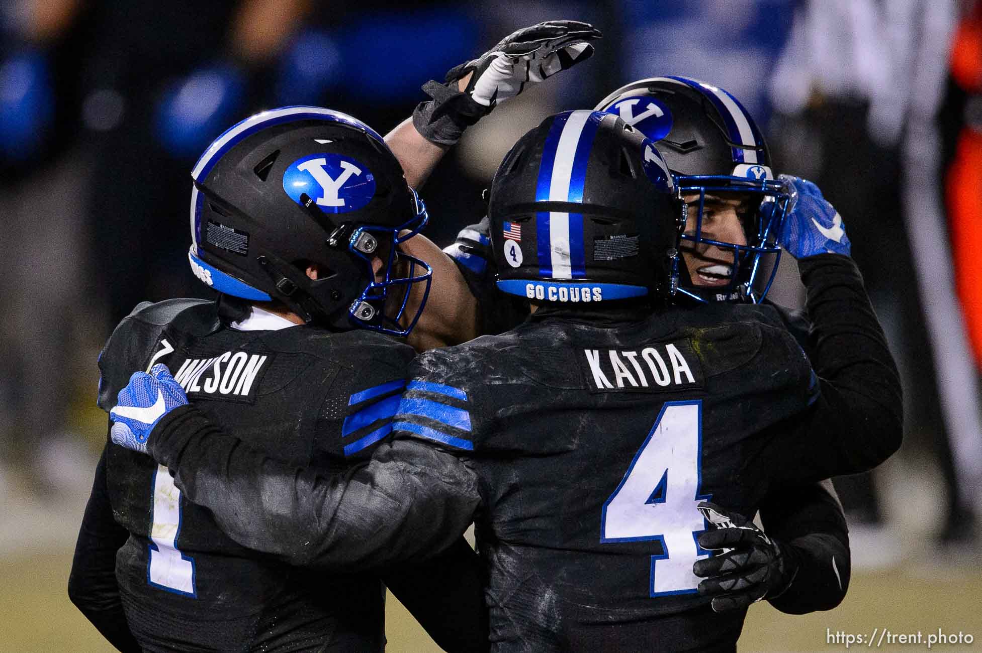 (Trent Nelson  |  The Salt Lake Tribune) Brigham Young Cougars quarterback Zach Wilson (1) celebrates the win with Brigham Young Cougars linebacker Isaiah Kaufusi (53) and Brigham Young Cougars running back Lopini Katoa (4) as BYU hosts San Diego State, NCAA football in Provo on Saturday, December 12, 2020.