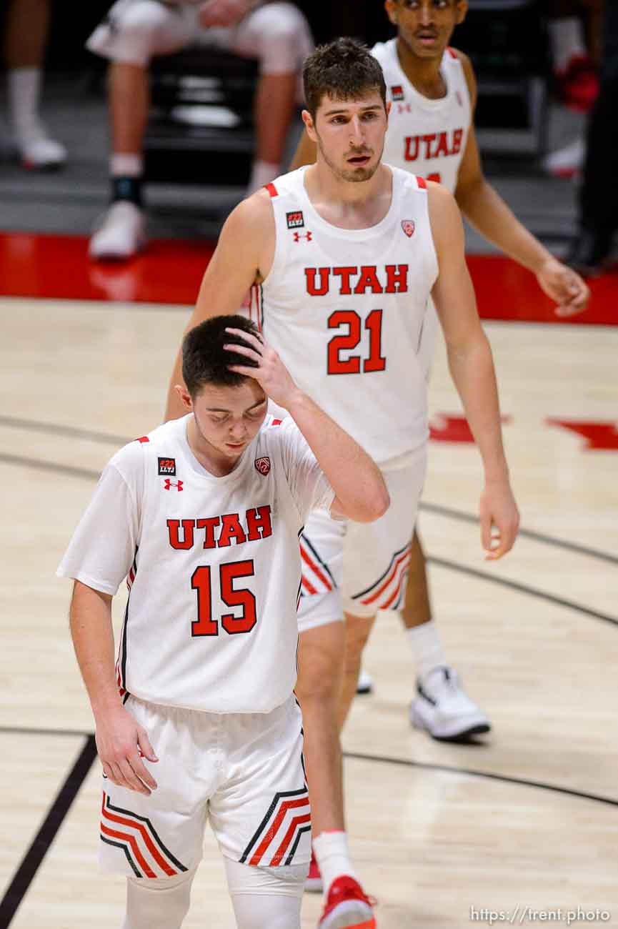 (Trent Nelson  |  The Salt Lake Tribune) Utah Utes guard Rylan Jones (15) and Utah Utes forward Riley Battin (21) walk off the court after the loss as Utah hosts Colorado, NCAA basketball in Salt Lake City on Monday, Jan. 11, 2021.