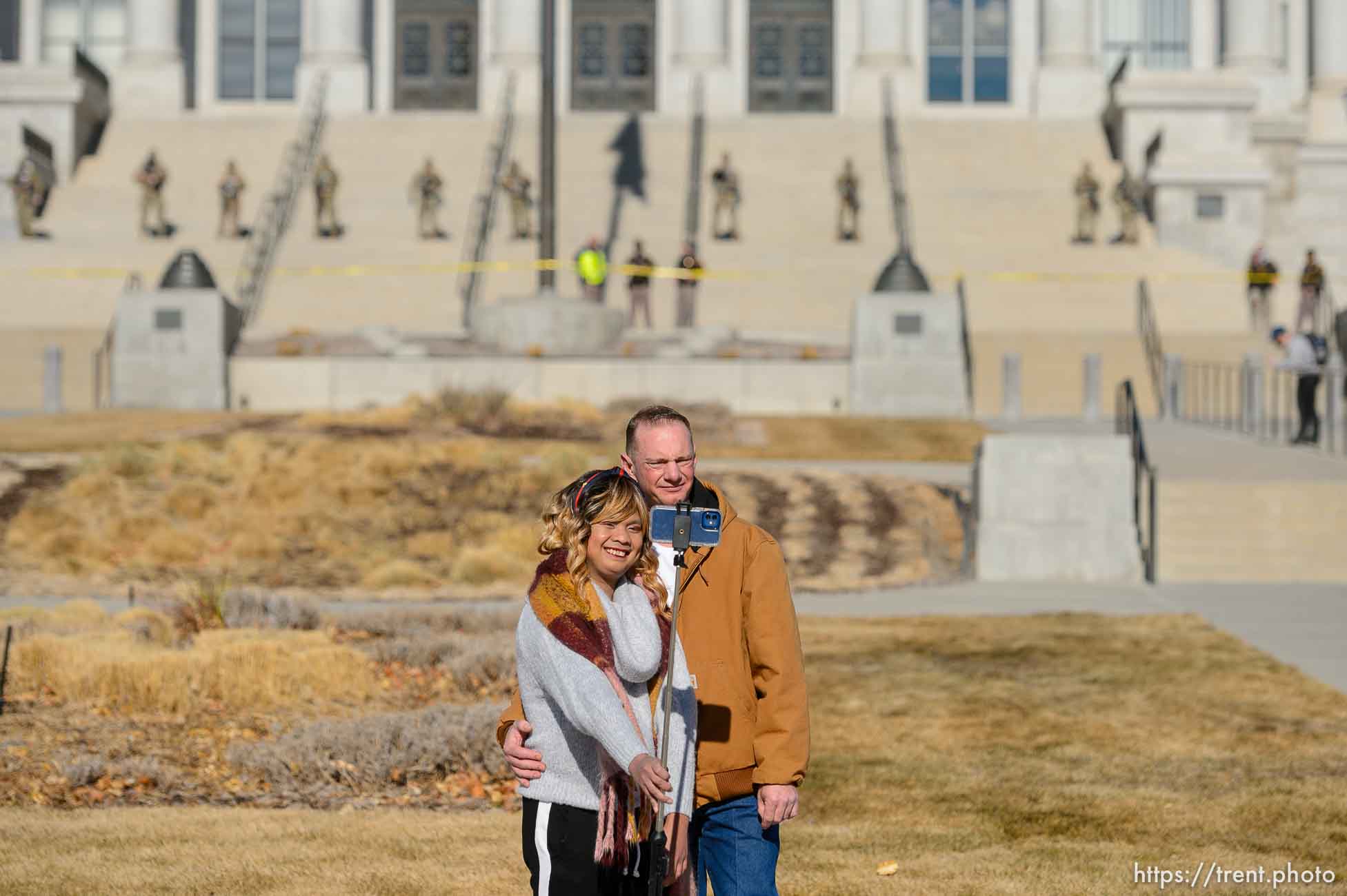 (Trent Nelson  |  The Salt Lake Tribune) A pair of tourists who didn't want to give their names pose for a selfie with National Guard troops guarding the state Capitol in Salt Lake City on Sunday, Jan. 17, 2021.