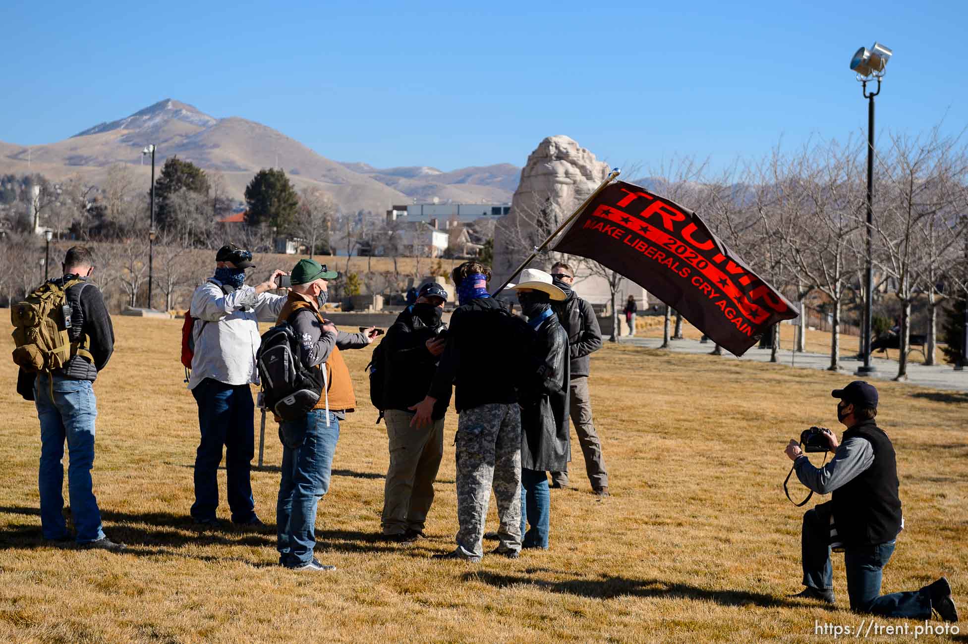 (Trent Nelson  |  The Salt Lake Tribune) Journalists outnumber a pair of Trump supporters at the state Capitol in Salt Lake City on Sunday, Jan. 17, 2021.