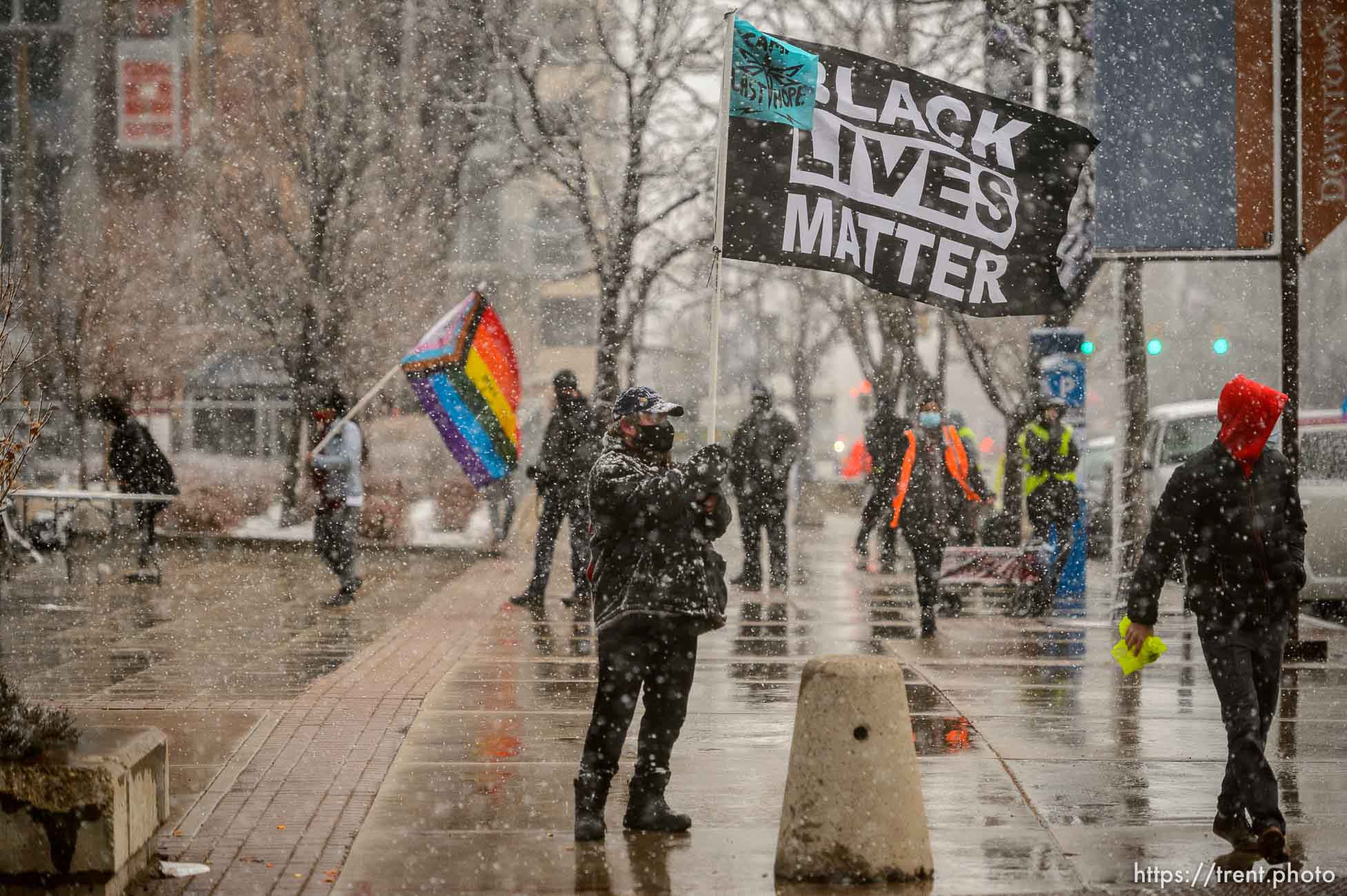 (Trent Nelson  |  The Salt Lake Tribune) Snow falls during a rally at the Federal Building in Salt Lake City on Martin Luther King Jr. Day, Monday, Jan. 18, 2021.