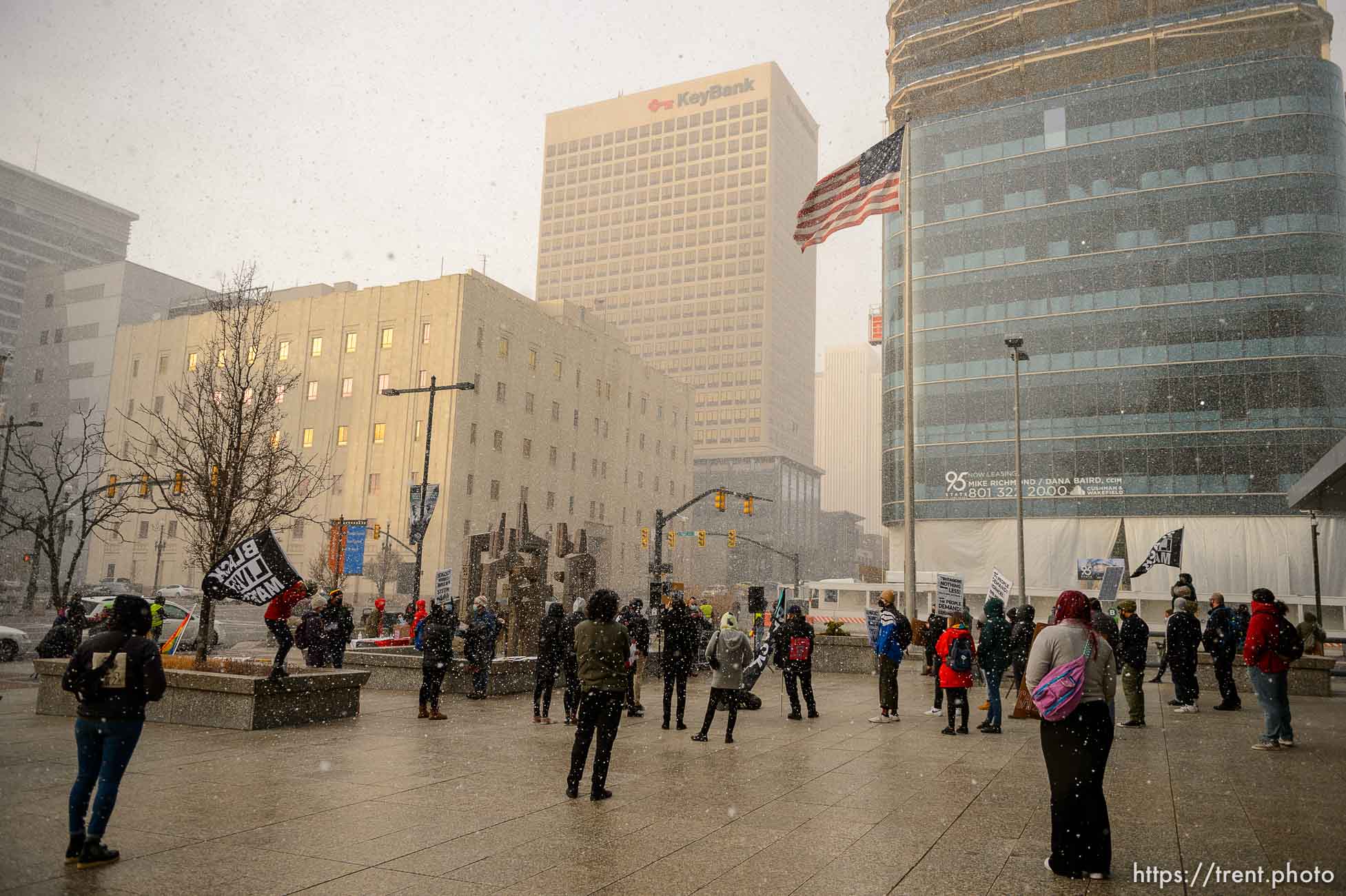 (Trent Nelson  |  The Salt Lake Tribune) Snow falls on a rally at the Federal Building in Salt Lake City on Martin Luther King Jr. Day, Monday, Jan. 18, 2021.