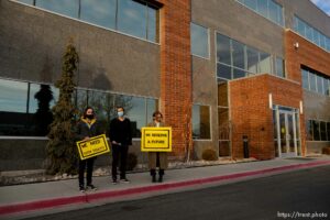 (Trent Nelson  |  The Salt Lake Tribune) Mark Lavelle, David Alonso, and Emma Lowe rally in front of the office of Rep. Burgess Owens, R-Utah, in West Jordan on Thursday, Jan. 21, 2021. The event is part of a nationwide effort by the Sunrise Movement, a national youth- and millenial-lead activist group, aiming to achieve racial, economic, and climate justice through the Green New Deal.