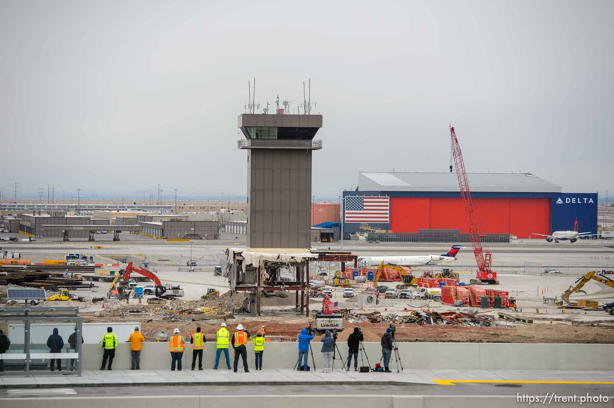 (Trent Nelson  |  The Salt Lake Tribune) Crews prepare to bring down the Delta Tower at the Salt Lake City International Airport on Monday, Feb. 15, 2021. The tower was originally built around 1989-90 for Delta Air Lines to direct aircraft to their gates after the FAA hands over the planes. The tower, which stands at 84 feet high, continued to operate until The New SLC opened on Sept. 15 and the replacement Delta tower became operational.