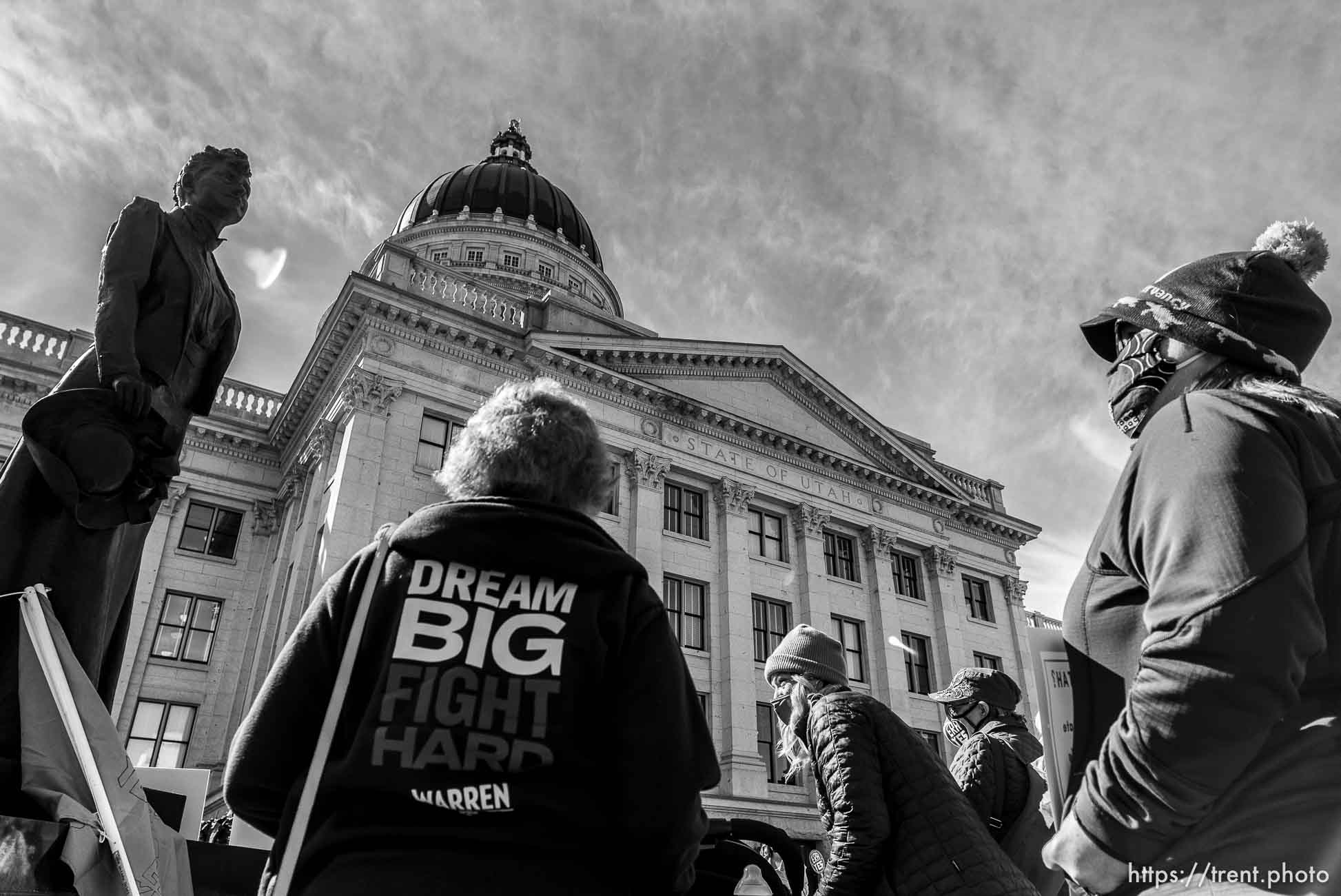 (Trent Nelson  |  The Salt Lake Tribune) People gather in support of the Equal Rights Amendment (ERA) in front of a statue of Martha Hughes Cannon at the state Capitol in Salt Lake City on Tuesday, March 2, 2021.