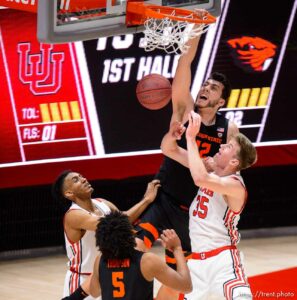 (Trent Nelson  |  The Salt Lake Tribune) Oregon State Beavers center Roman Silva (12) dunks the ball ahead of Utah Utes center Branden Carlson (35) as Utah hosts Oregon State, NCAA basketball in Salt Lake City on Wednesday, March 3, 2021.