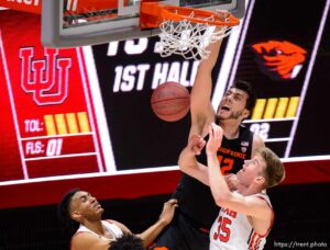 (Trent Nelson  |  The Salt Lake Tribune) Oregon State Beavers center Roman Silva (12) dunks the ball ahead of Utah Utes center Branden Carlson (35) as Utah hosts Oregon State, NCAA basketball in Salt Lake City on Wednesday, March 3, 2021.