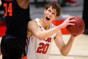 (Trent Nelson  |  The Salt Lake Tribune) Utah Utes forward Mikael Jantunen (20) looks to shoot with Oregon State Beavers forward Rodrigue Andela (34) defending as Utah hosts Oregon State, NCAA basketball in Salt Lake City on Wednesday, March 3, 2021.