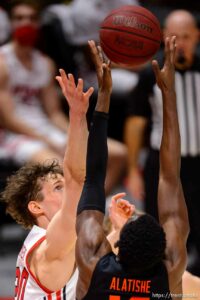 (Trent Nelson  |  The Salt Lake Tribune) Utah Utes forward Mikael Jantunen (20) and Oregon State Beavers forward Warith Alatishe (10) reach for a rebound as Utah hosts Oregon State, NCAA basketball in Salt Lake City on Wednesday, March 3, 2021.