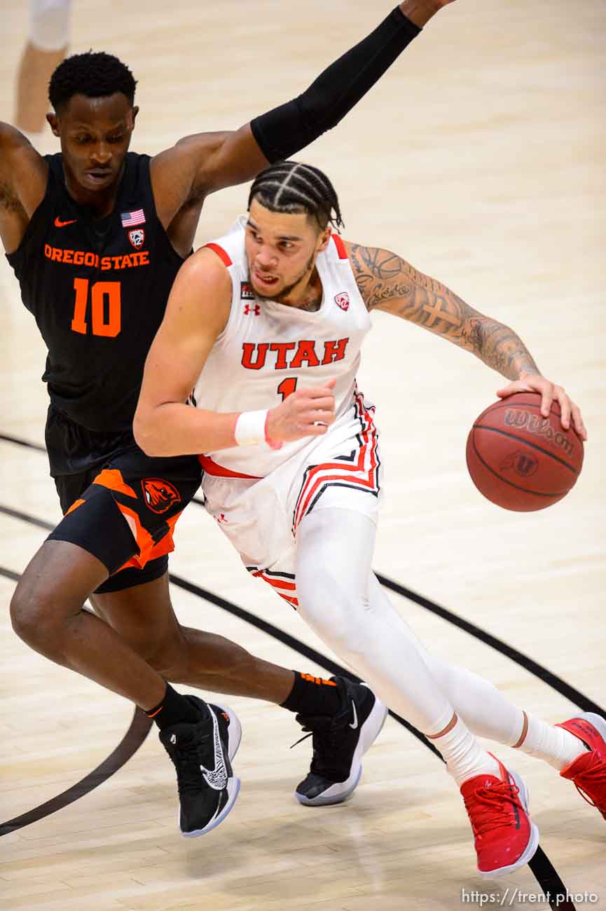 (Trent Nelson  |  The Salt Lake Tribune) Utah Utes forward Timmy Allen (1) drives on Oregon State Beavers forward Warith Alatishe (10) as Utah hosts Oregon State, NCAA basketball in Salt Lake City on Wednesday, March 3, 2021.