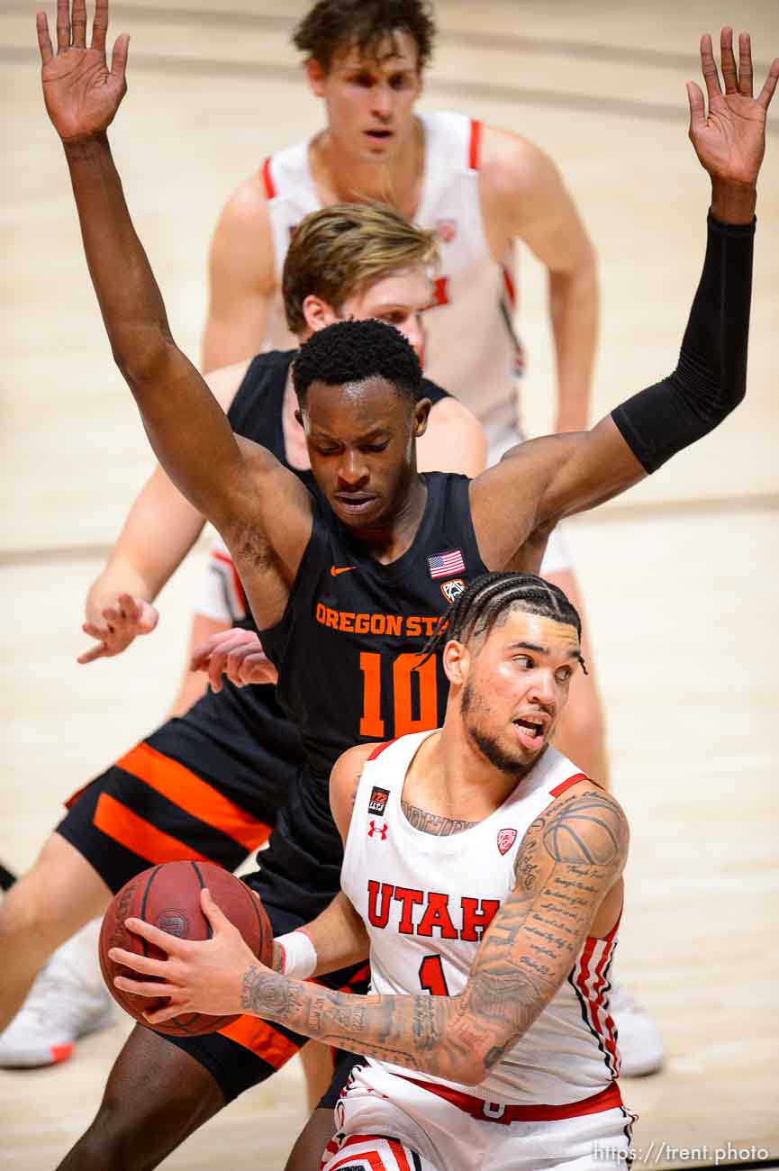 (Trent Nelson  |  The Salt Lake Tribune) Utah Utes forward Timmy Allen (1) defended by Oregon State Beavers forward Warith Alatishe (10) as Utah hosts Oregon State, NCAA basketball in Salt Lake City on Wednesday, March 3, 2021.