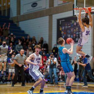 (Trent Nelson  |  The Salt Lake Tribune) Lehi's Peter Amakasu dunks the ball in the final minute as Lehi defeats Farmington High School in the 5A boys basketball state championship game, in Taylorsville on Saturday, March 6, 2021.