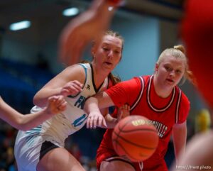 (Trent Nelson  |  The Salt Lake Tribune) Farmington's Delaney Baker and Springville's Addisyn Johnson as Springville faces Farmington High School in the 5A girls basketball state championship game, in Taylorsville on Saturday, March 6, 2021.