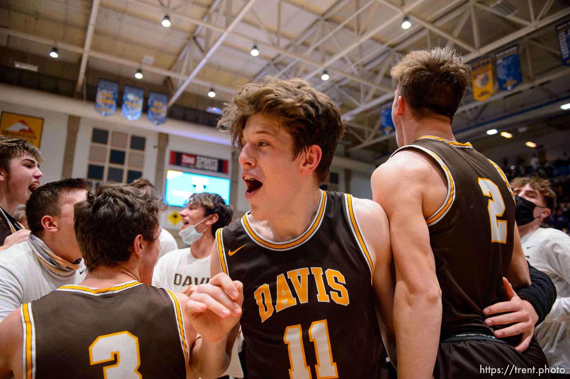 (Trent Nelson  |  The Salt Lake Tribune) Davis players celebrate after defeating Westlake High School in the 6A boys basketball state championship game, in Taylorsville on Saturday, March 6, 2021.