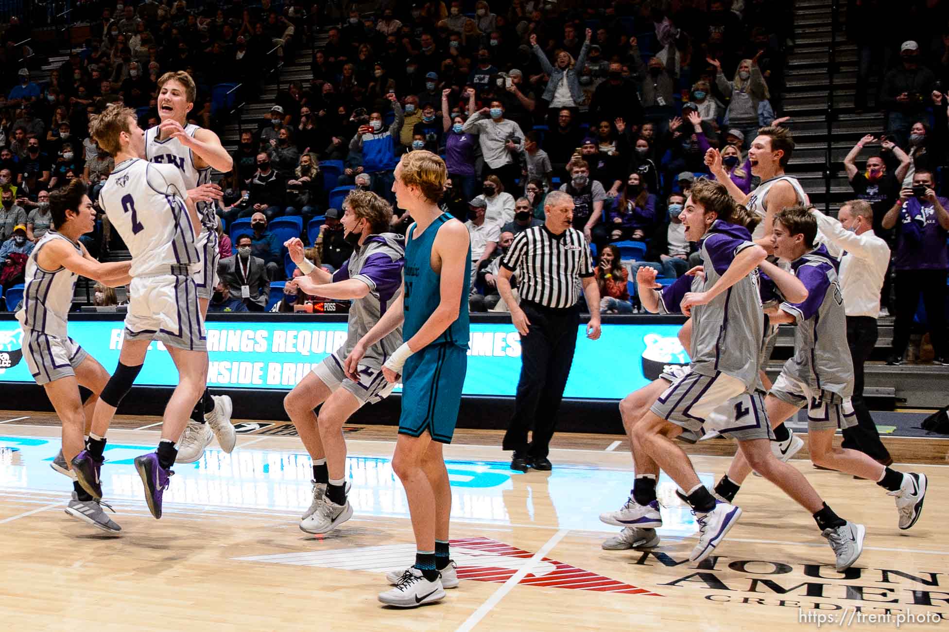 (Trent Nelson  |  The Salt Lake Tribune) Lehi players celebrate a win over Farmington High School in the 5A boys basketball state championship game, in Taylorsville on Saturday, March 6, 2021.