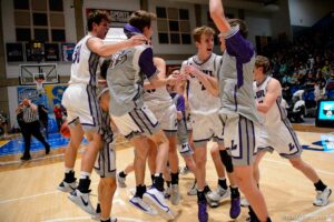 (Trent Nelson  |  The Salt Lake Tribune) Lehi players celebrate a win over Farmington High School in the 5A boys basketball state championship game, in Taylorsville on Saturday, March 6, 2021.