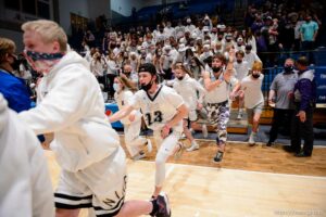 (Trent Nelson  |  The Salt Lake Tribune) Lehi fans rush the court to celebrate a win over Farmington High School in the 5A boys basketball state championship game, in Taylorsville on Saturday, March 6, 2021.