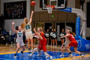 (Trent Nelson  |  The Salt Lake Tribune) Farmington's Abigail Ferrell puts up a one-handed go-ahead shot in the final seconds as Springville faces Farmington High School in the 5A girls basketball state championship game, in Taylorsville on Saturday, March 6, 2021.