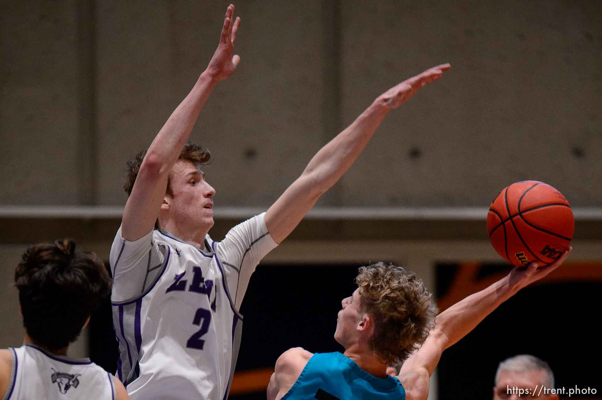 (Trent Nelson  |  The Salt Lake Tribune) Farmington's Collin Chandler is defended by Lehi's Tyson Hawkins as Lehi defeats Farmington High School in the 5A boys basketball state championship game, in Taylorsville on Saturday, March 6, 2021.