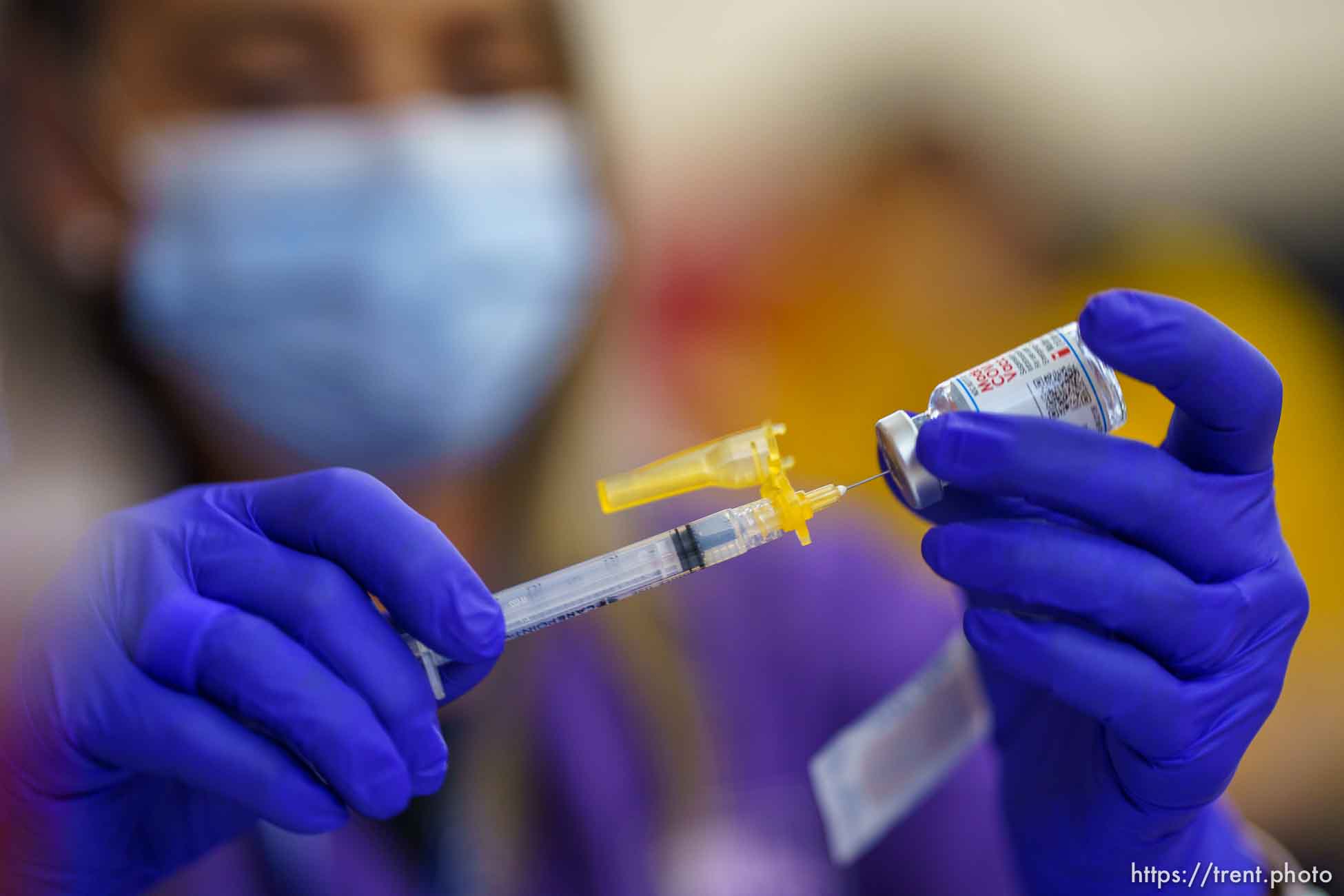 (Trent Nelson  |  The Salt Lake Tribune) Lacie Odom preps a shot as teachers and staff of the Canyons School District received their second shots of the Moderna vaccine at Mount Jordan Middle School in Sandy on Thursday, March 11, 2021.