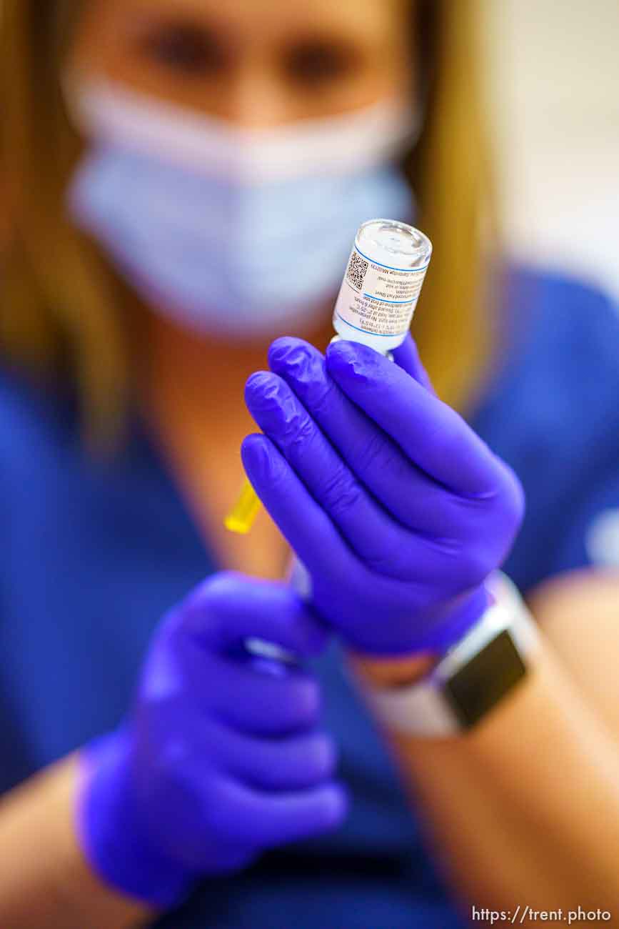 (Trent Nelson  |  The Salt Lake Tribune) Marielle Nielsen  preps a shot as teachers and staff of the Canyons School District received their second shots of the Moderna vaccine at Mount Jordan Middle School in Sandy on Thursday, March 11, 2021.