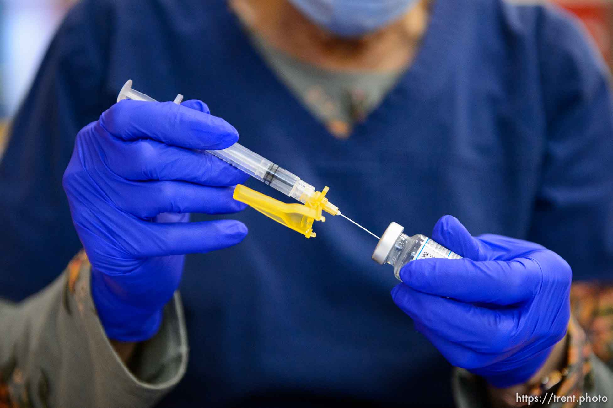 (Trent Nelson  |  The Salt Lake Tribune) Marilyn Gertsch preps a shot as teachers and staff of the Canyons School District received their second shots of the Moderna vaccine at Mount Jordan Middle School in Sandy on Thursday, March 11, 2021.