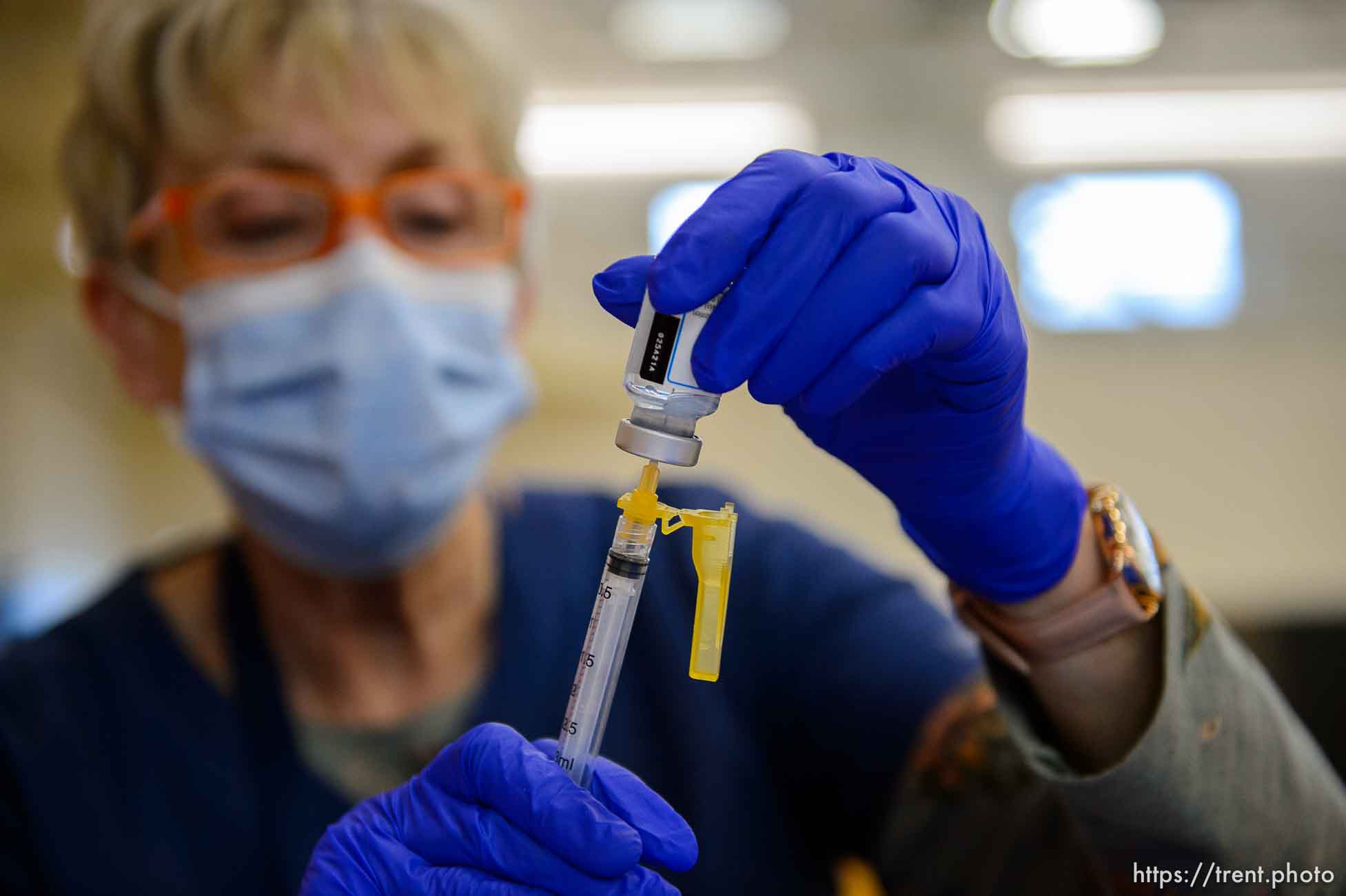 (Trent Nelson  |  The Salt Lake Tribune) Marilyn Gertsch preps a shot as teachers and staff of the Canyons School District received their second shots of the Moderna vaccine at Mount Jordan Middle School in Sandy on Thursday, March 11, 2021.