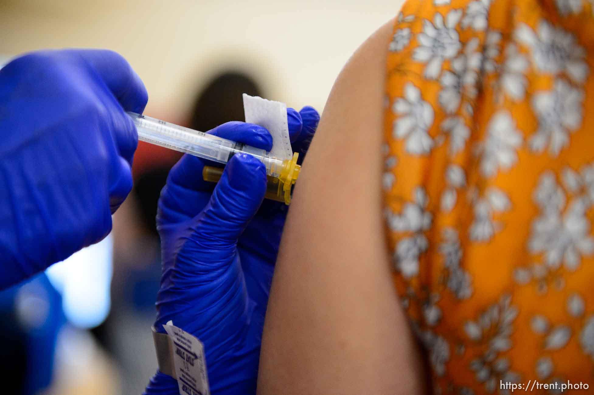 (Trent Nelson  |  The Salt Lake Tribune) Lacie Odom administers a shot as teachers and staff of the Canyons School District received their second shots of the Moderna vaccine at Mount Jordan Middle School in Sandy on Thursday, March 11, 2021.