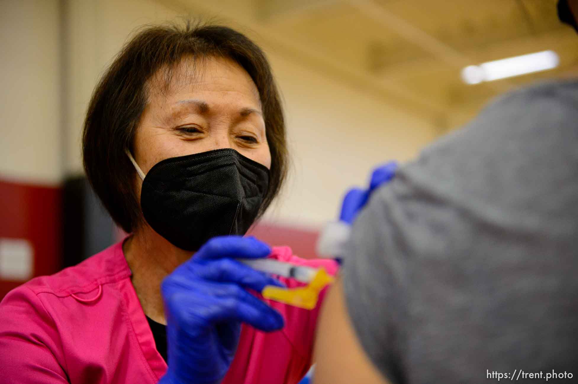 (Trent Nelson  |  The Salt Lake Tribune) Donna Burton administers a shot as teachers and staff of the Canyons School District received their second shots of the Moderna vaccine at Mount Jordan Middle School in Sandy on Thursday, March 11, 2021.