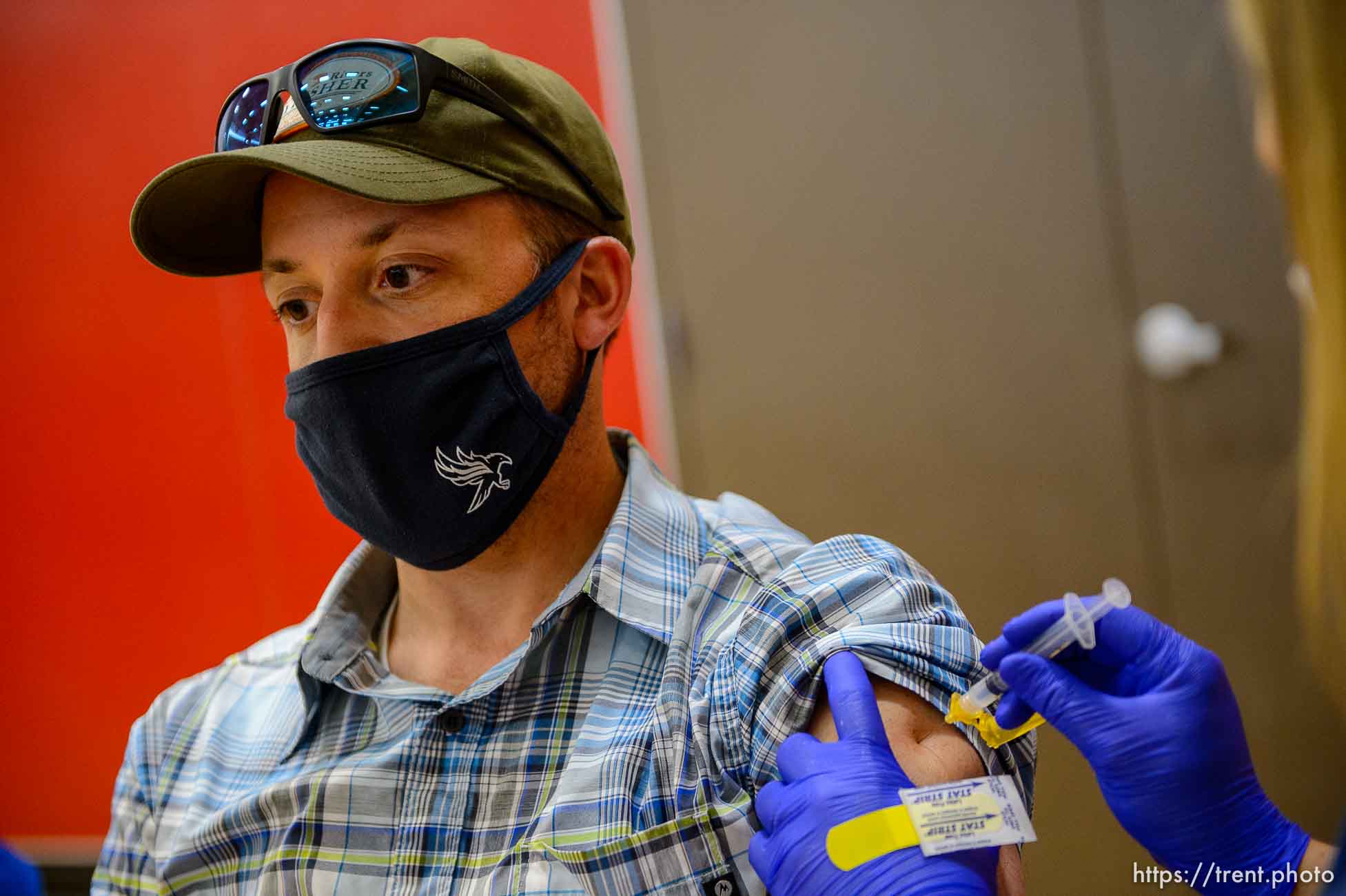 (Trent Nelson  |  The Salt Lake Tribune) Matt Israel is vaccinated as teachers and staff of the Canyons School District received their second shots of the Moderna vaccine at Mount Jordan Middle School in Sandy on Thursday, March 11, 2021.