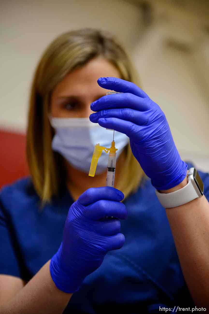 (Trent Nelson  |  The Salt Lake Tribune) Marielle Nielsen  preps a shot as teachers and staff of the Canyons School District received their second shots of the Moderna vaccine at Mount Jordan Middle School in Sandy on Thursday, March 11, 2021.