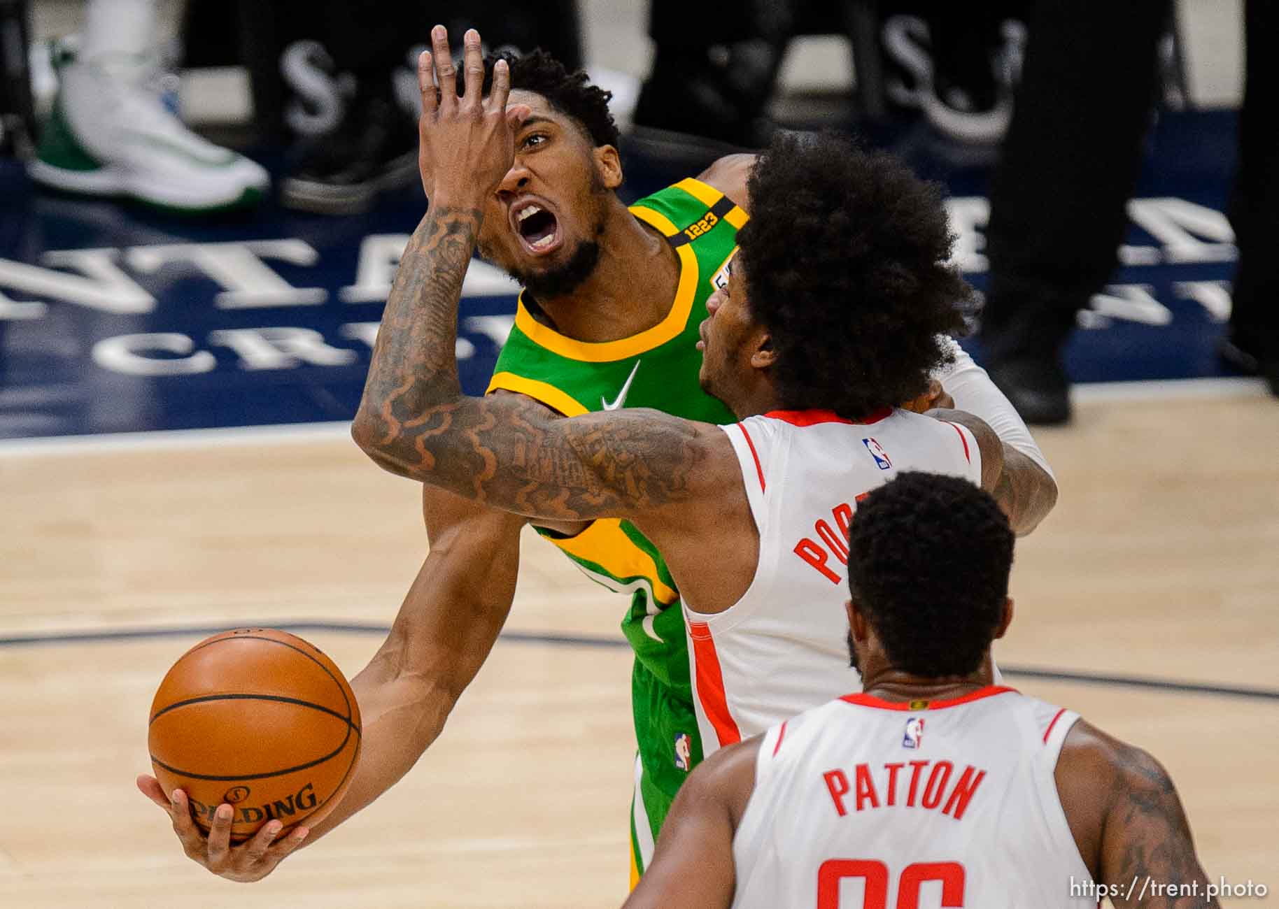 (Trent Nelson  |  The Salt Lake Tribune) Utah Jazz guard Donovan Mitchell (45) puts up a shot around Houston Rockets guard Kevin Porter Jr. (3) as the Utah Jazz host the Houston Rockets, NBA basketball in Salt Lake City on Friday, March 12, 2021.