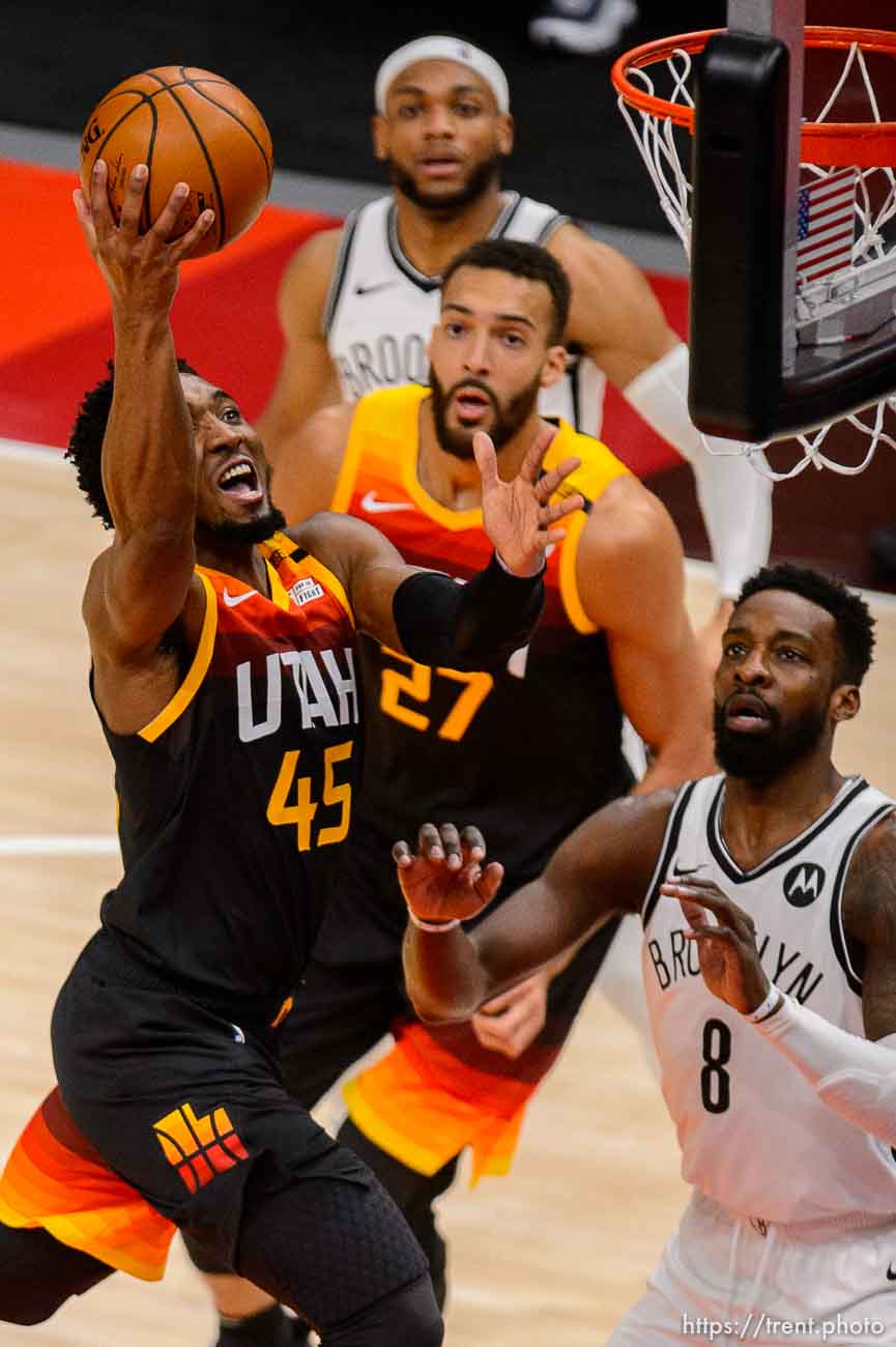 (Trent Nelson  |  The Salt Lake Tribune) Utah Jazz guard Donovan Mitchell (45) scores as the Utah Jazz host the Brooklyn Nets, NBA basketball in Salt Lake City on Wednesday, March 24, 2021.