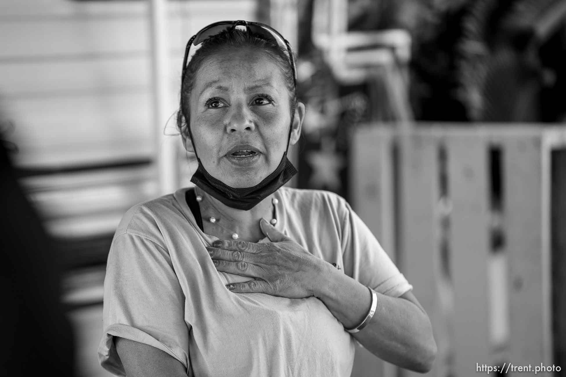 (Trent Nelson  |  The Salt Lake Tribune) July Vasquez talks with neighbor Jason Williams in front of her mobile home in Riverdale on Wednesday, April 7, 2021. The property owner of the Lesley's Mobile Home Park in Riverdale is attempting to rezone and redevelop the site. In the meantime, the landlord has raised rent by $200 a month.