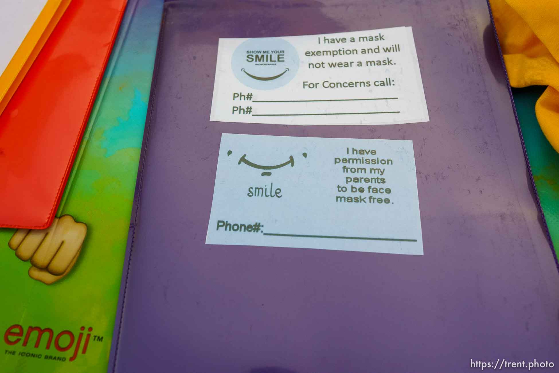 (Trent Nelson  |  The Salt Lake Tribune) Mask exemption cards at a rally outside of the Granite School District offices in South Salt Lake on Saturday, April 10, 2021. Rallies were announced for all Utah school district offices by a coalition of groups opposed to mask mandates.