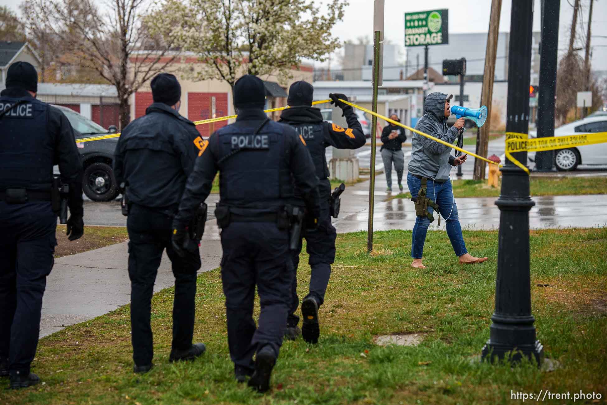 (Trent Nelson  |  The Salt Lake Tribune) Lex Scott and police, as Salt Lake County conducts a camp cleanup at the Fleet Block Murals in Salt Lake City on Wednesday, April 14, 2021.