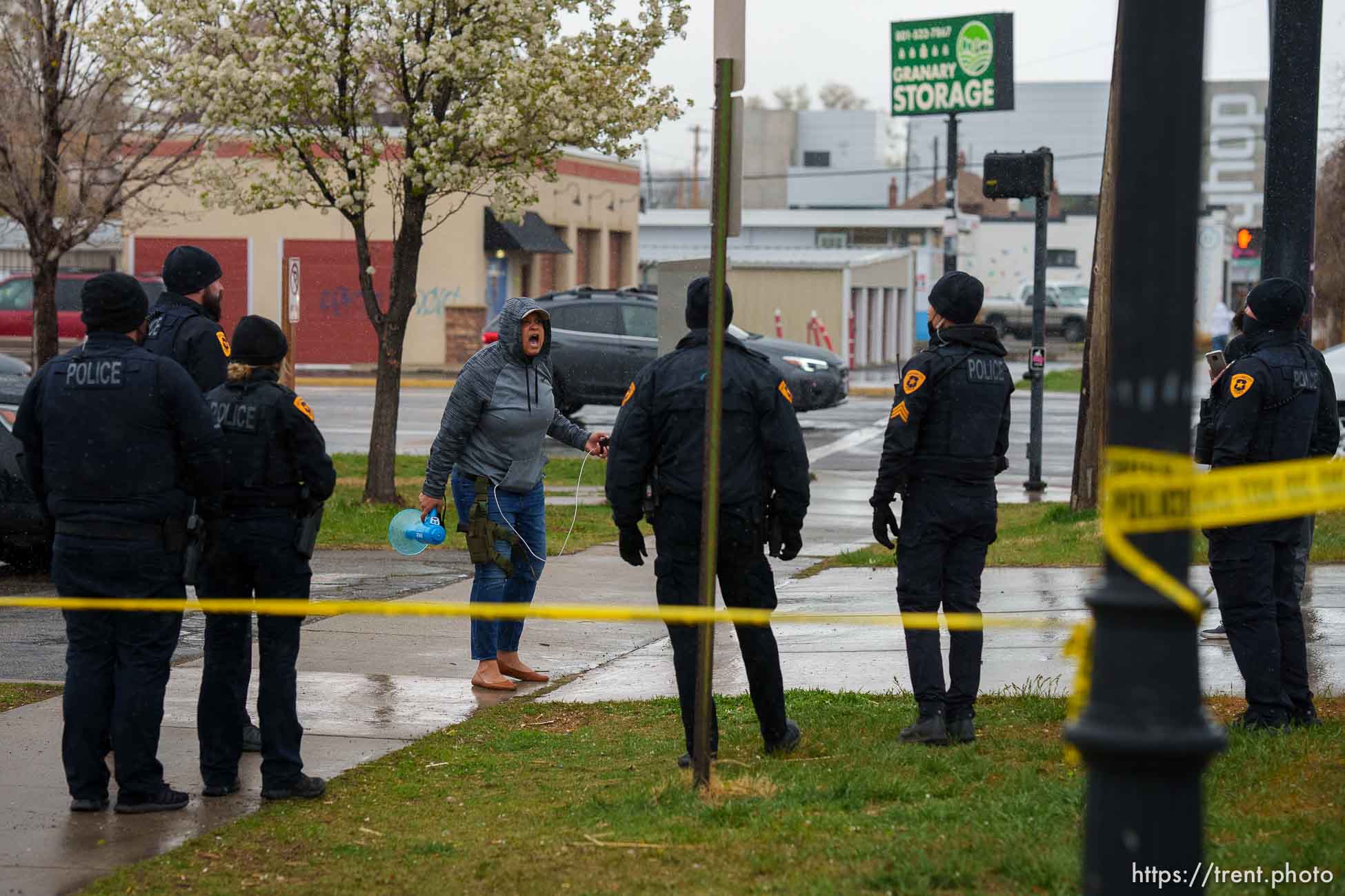 (Trent Nelson  |  The Salt Lake Tribune) Lex Scott and police, as Salt Lake County conducts a camp cleanup at the Fleet Block Murals in Salt Lake City on Wednesday, April 14, 2021.