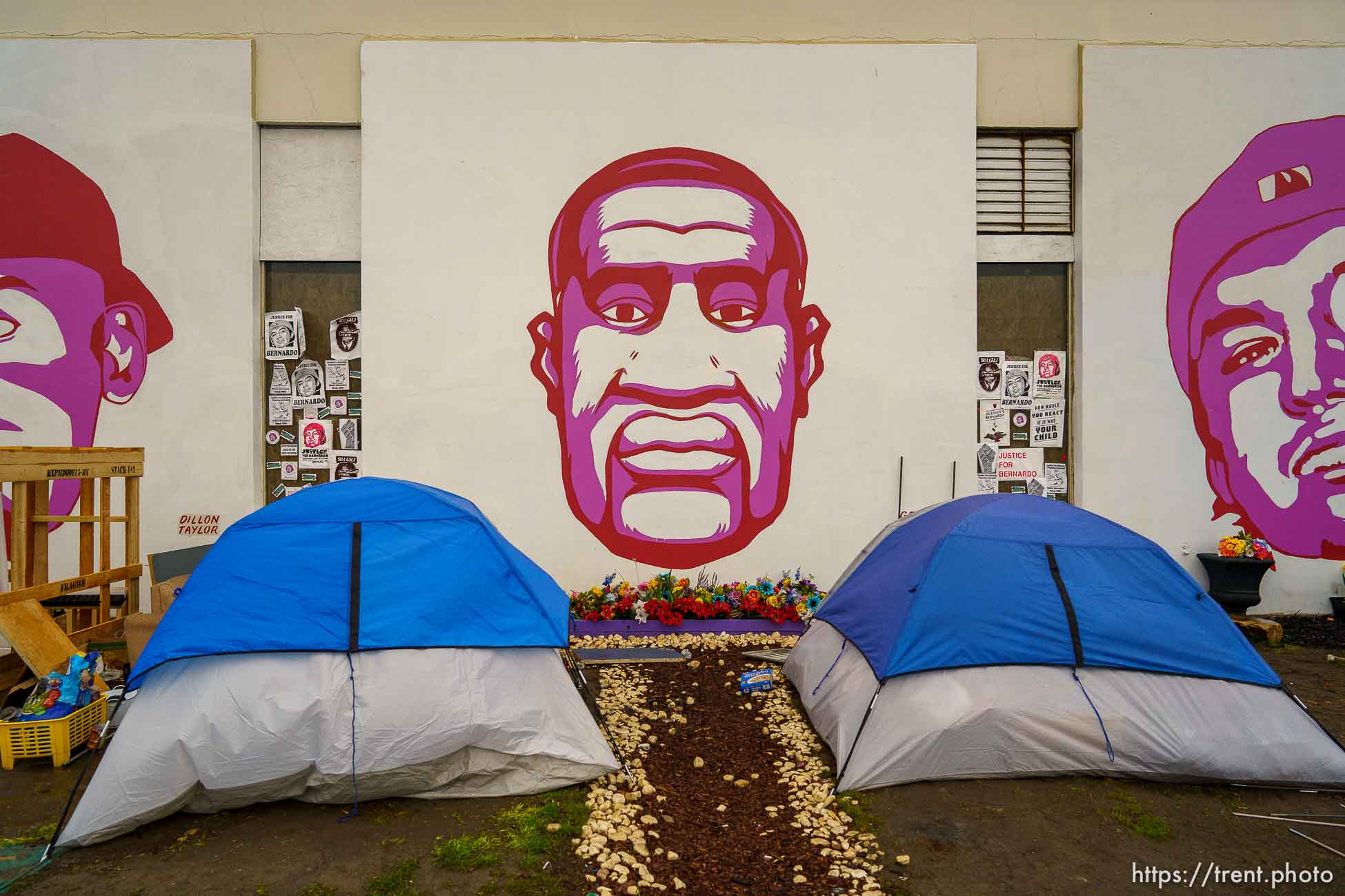 (Trent Nelson  |  The Salt Lake Tribune) Tents in front of a portrait of George Floyd before a camp cleanup at the Fleet Block Murals in Salt Lake City on Wednesday, April 14, 2021.