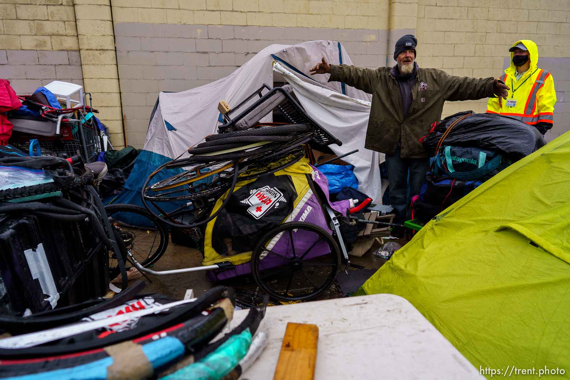 (Trent Nelson  |  The Salt Lake Tribune) A man asks for, and is granted, more time to move his belongings as Salt Lake County conducts a camp cleanup at the Fleet Block Murals in Salt Lake City on Wednesday, April 14, 2021.