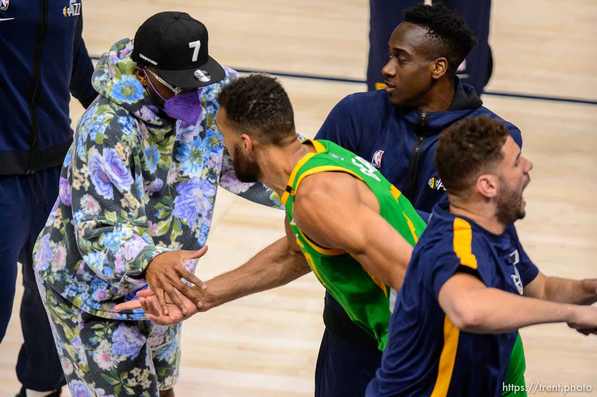 (Trent Nelson  |  The Salt Lake Tribune) Utah Jazz guard Donovan Mitchell (in street cloths) high-fives Utah Jazz center Rudy Gobert (27) as the Utah Jazz host the Minnesota Timberwolves, NBA basketball in Salt Lake City on Saturday, April 24, 2021.