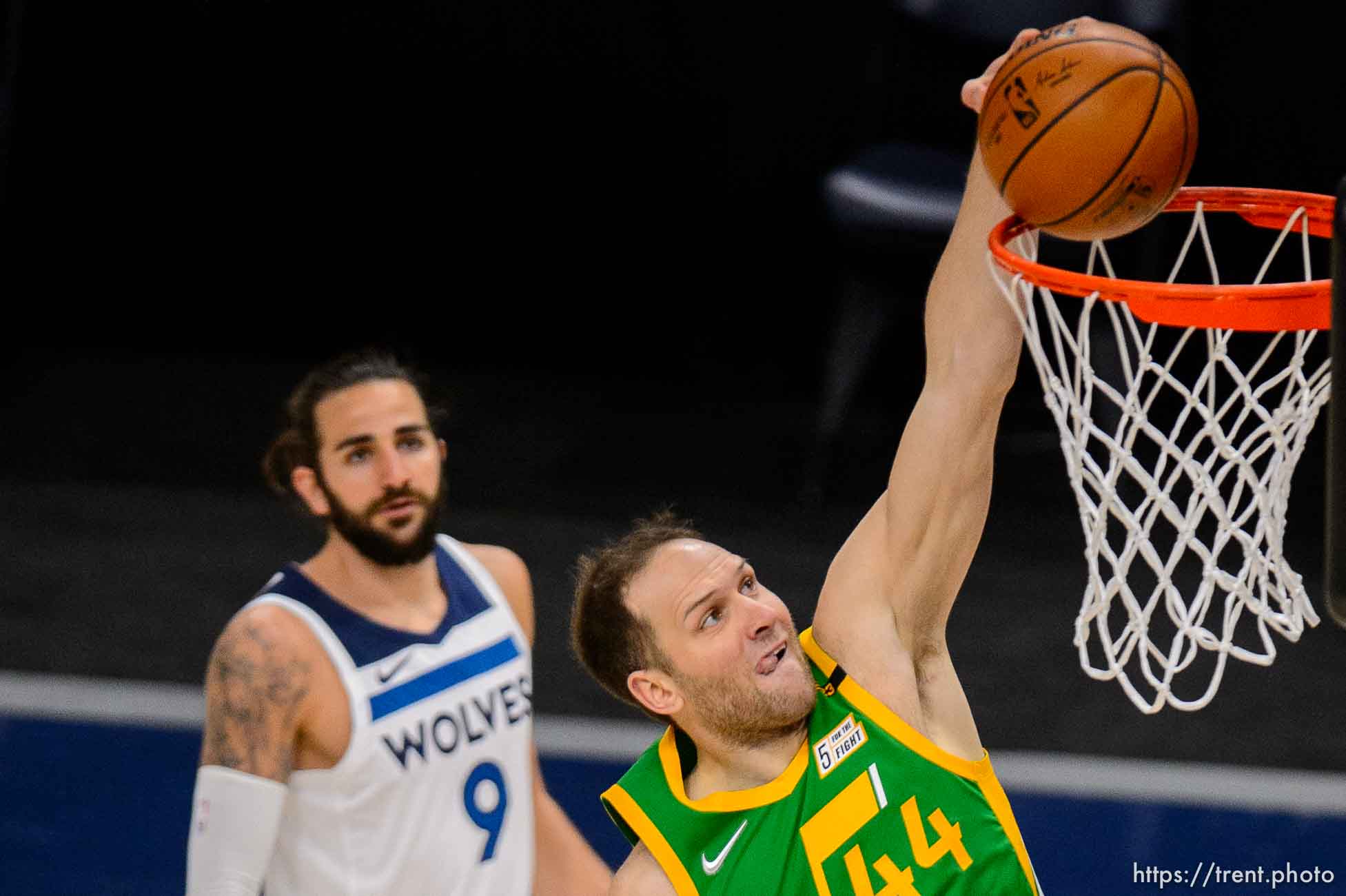 (Trent Nelson  |  The Salt Lake Tribune) Utah Jazz forward Bojan Bogdanovic (44) dunks the ball as the Utah Jazz host the Minnesota Timberwolves, NBA basketball in Salt Lake City on Saturday, April 24, 2021. At rear is Minnesota Timberwolves guard Ricky Rubio (9).