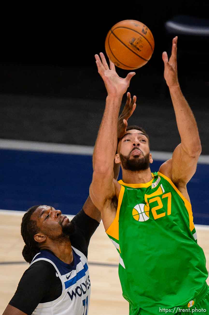 (Trent Nelson  |  The Salt Lake Tribune) Utah Jazz center Rudy Gobert (27) scores with Minnesota Timberwolves center Naz Reid (11) defending as the Utah Jazz host the Minnesota Timberwolves, NBA basketball in Salt Lake City on Saturday, April 24, 2021.