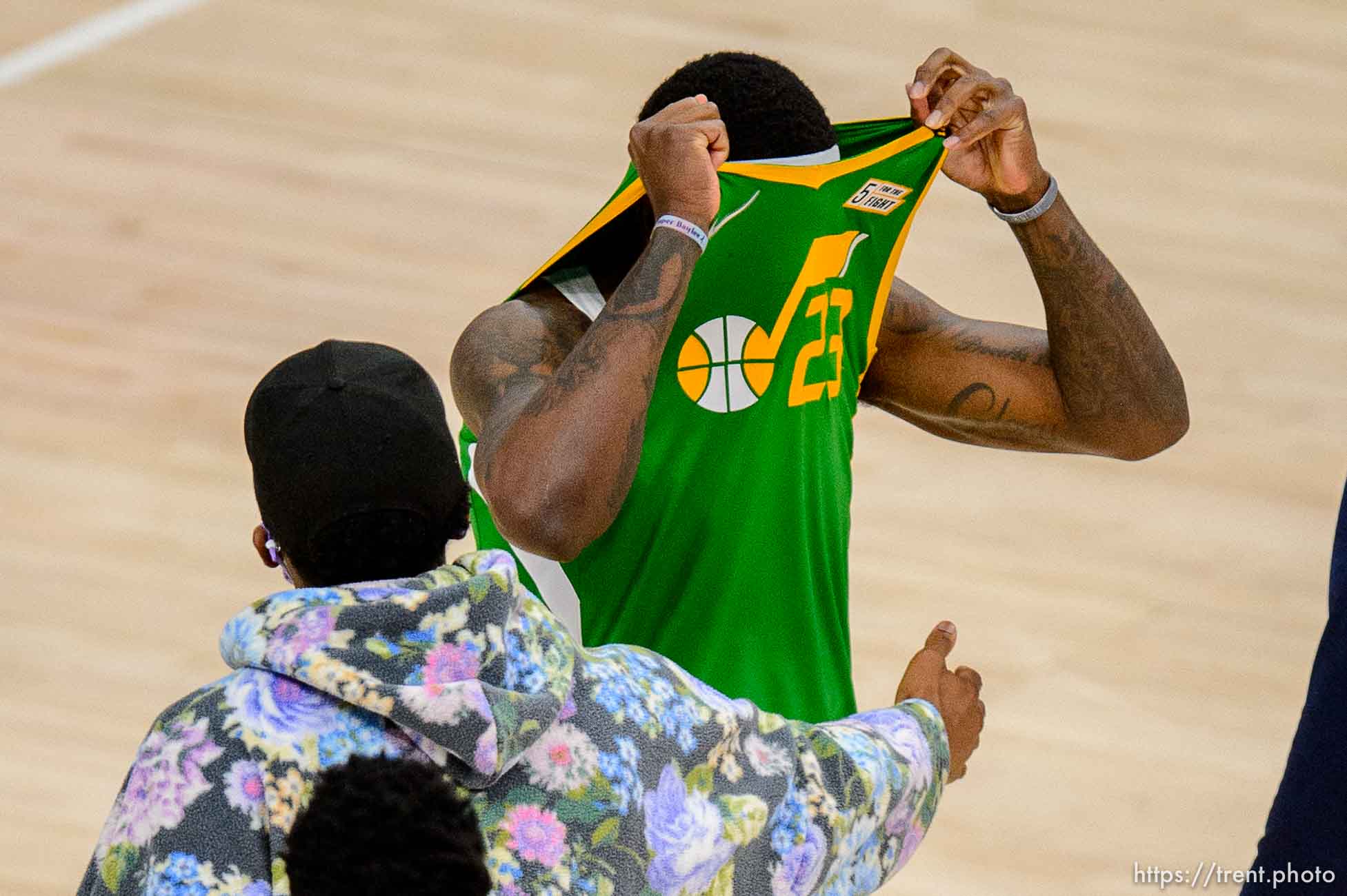 (Trent Nelson  |  The Salt Lake Tribune) Utah Jazz forward Royce O'Neale (23) pulls his jersey over his head after the 96-101 loss as the Utah Jazz host the Minnesota Timberwolves, NBA basketball in Salt Lake City on Saturday, April 24, 2021. Reaching in, in street clothes, is Utah Jazz guard Donovan Mitchell (45).