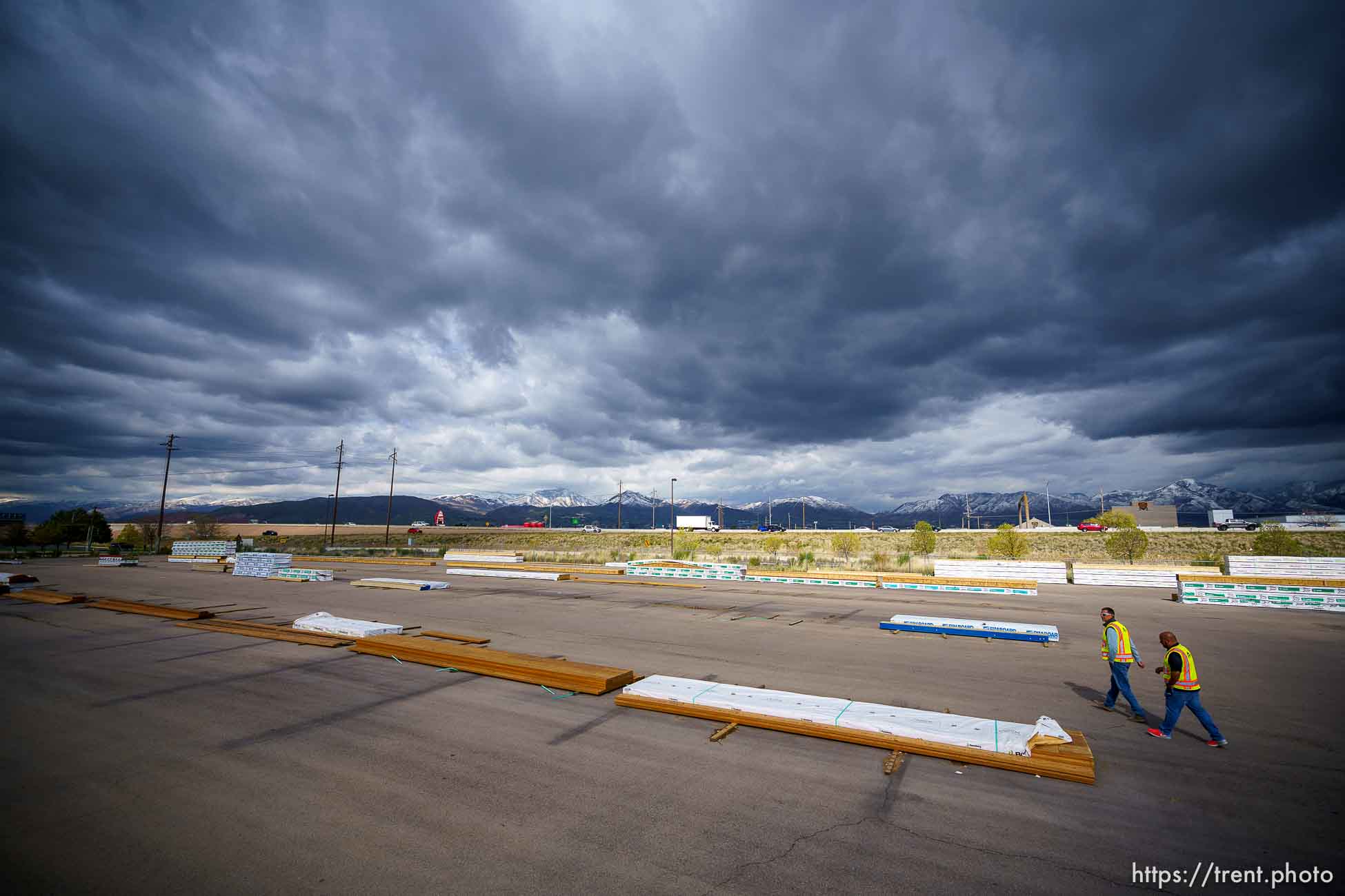 (Trent Nelson  |  The Salt Lake Tribune) Jason Butterfield and Jason Barnett walk through the sparse yard a Sunpro in Salt Lake City on Tuesday, April 27, 2021. A national shortage of lumber is stalling and driving up costs on big construction projects and small home improvements alike in Utah.