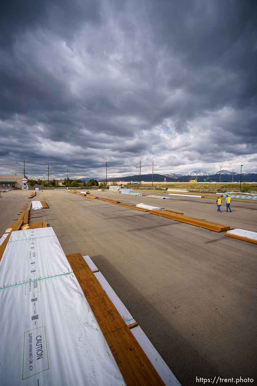 (Trent Nelson  |  The Salt Lake Tribune) Jason Butterfield and Jason Barnett walk through the sparse yard a Sunpro in Salt Lake City on Tuesday, April 27, 2021. A national shortage of lumber is stalling and driving up costs on big construction projects and small home improvements alike in Utah.